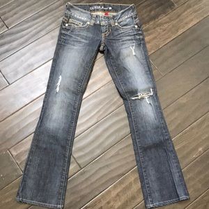 Guess light blue ripped bootcut jeans